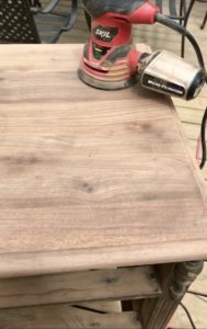 Sanding the dresser.