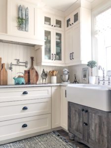 A white kitchen sets the background for some colour and some plants come spring.