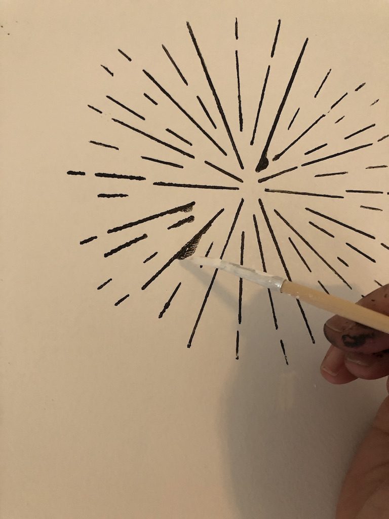 touching up a stencilled wall
