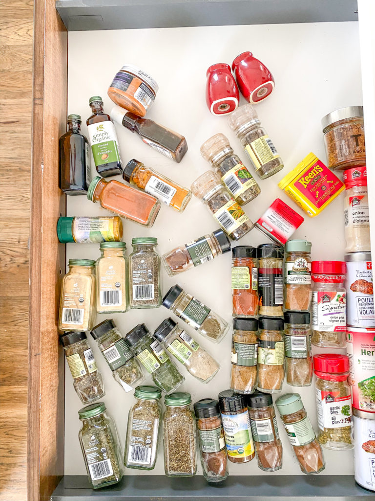 unorganized spice drawer
