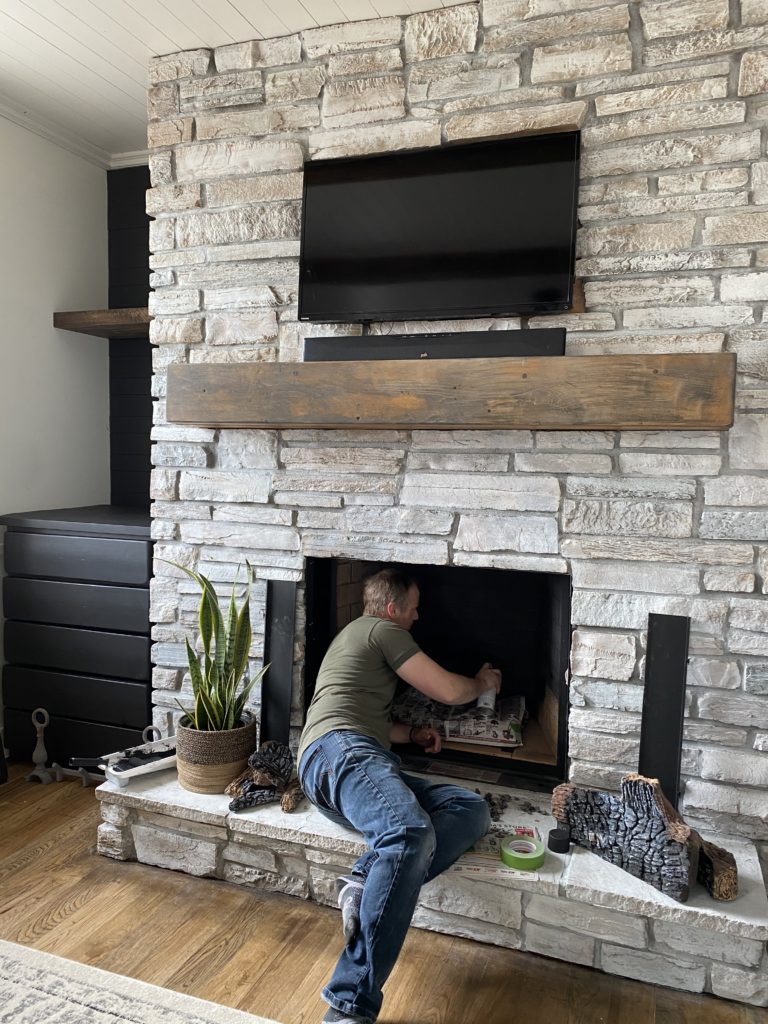 whitewash stone fireplace before and after