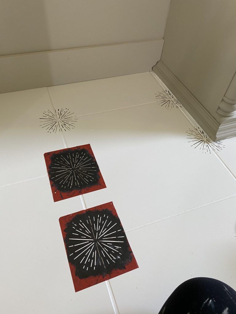 Creating the stencilled pattern on staggered tile.