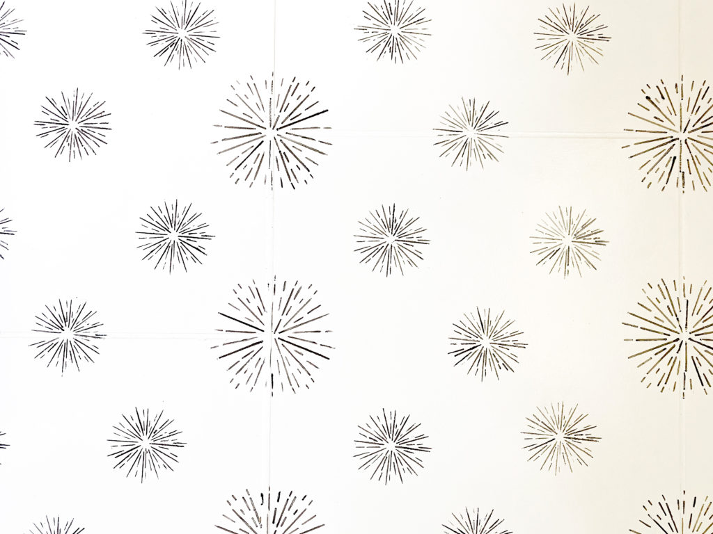 Stencilled floor on Staggered tiles.
